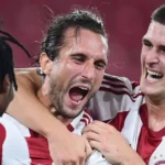 olympiacos karaiskakis atmosphere red flares
