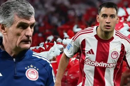 Ο Σαντιάγκο Έσε με τη φανέλα του Ολυμπιακού μαρκάρει δυναμικά αντίπαλο σε αγώνα της SuperLeague